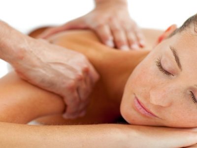 Beautiful woman enjoying a massage in a spa center